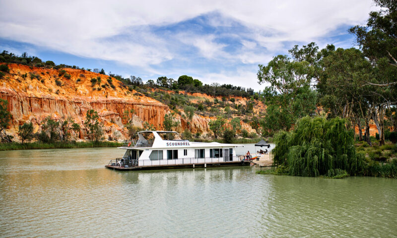 A houseboat gently drifting down the Murray River. 