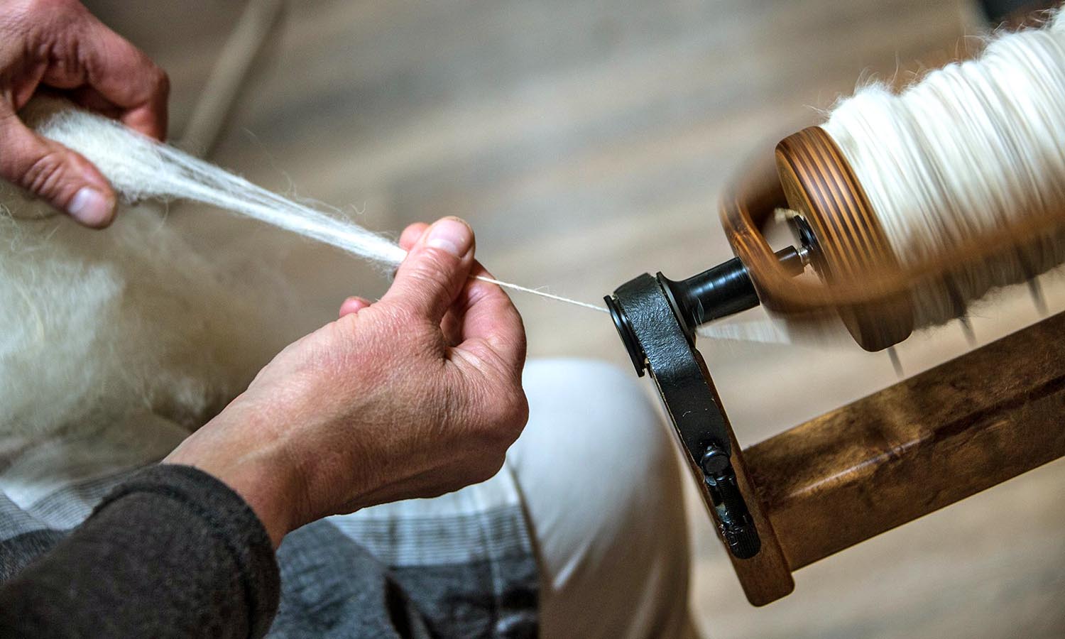 A man spins some yarn. 