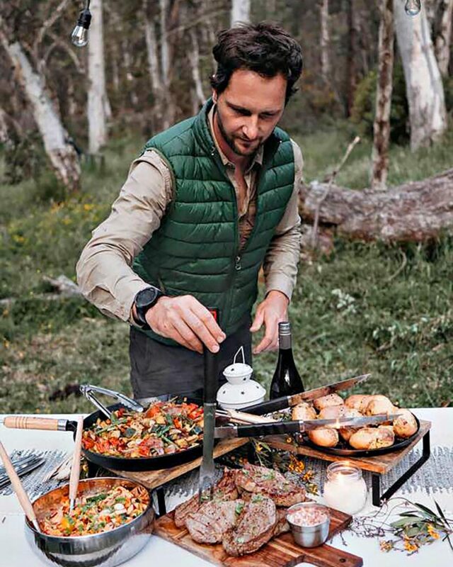 A man cooks up a rustic feast in the middle of the Victorian wilderness.
