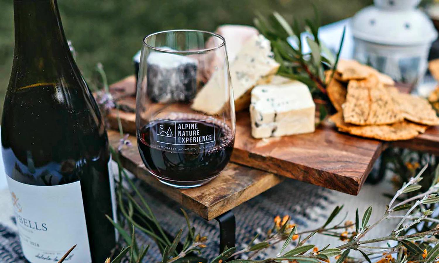 A glass of wine and cheese board at a local winery in Victoria.