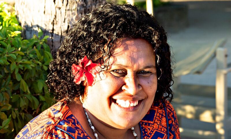 A local worker of Turtle Island smiles at the camera.
