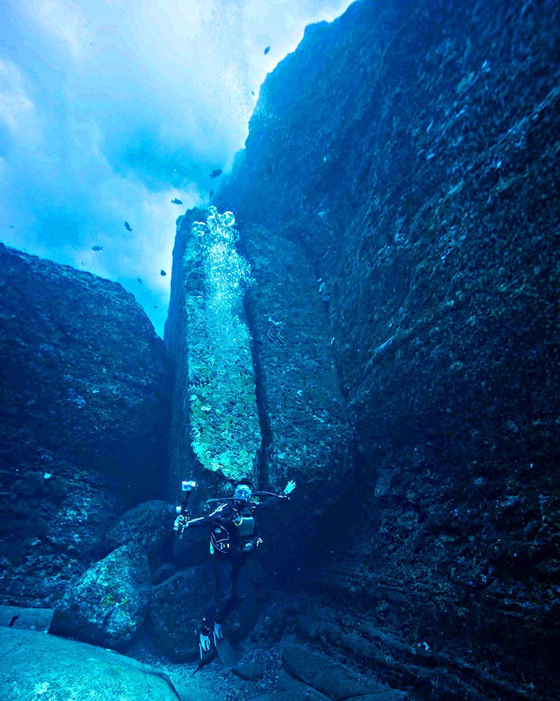 Diver looking up at Monument diving Yonaguni.