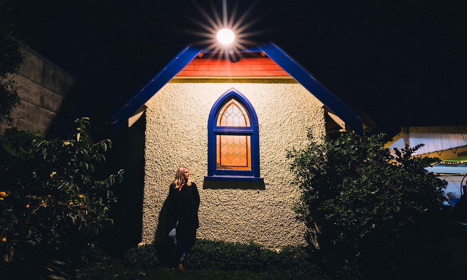 Standing outside the unique Free House pub in a converted church.