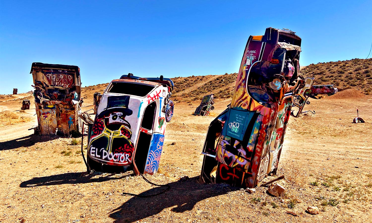 A group of colourful, abandoned cars now being used as part of an art exhibit in Nevada.