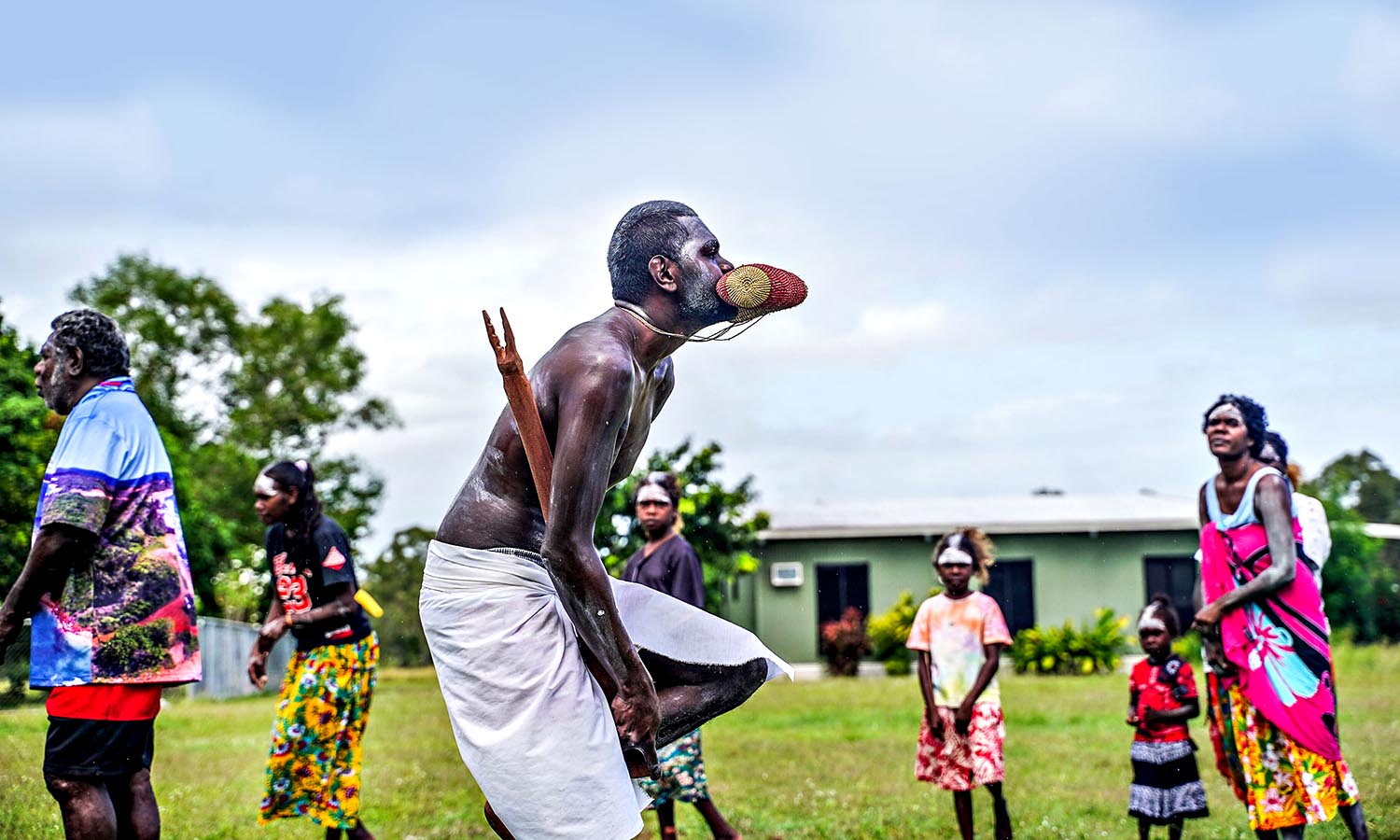 A group of members of the Dhalinbuy community perform a welcome dance.
