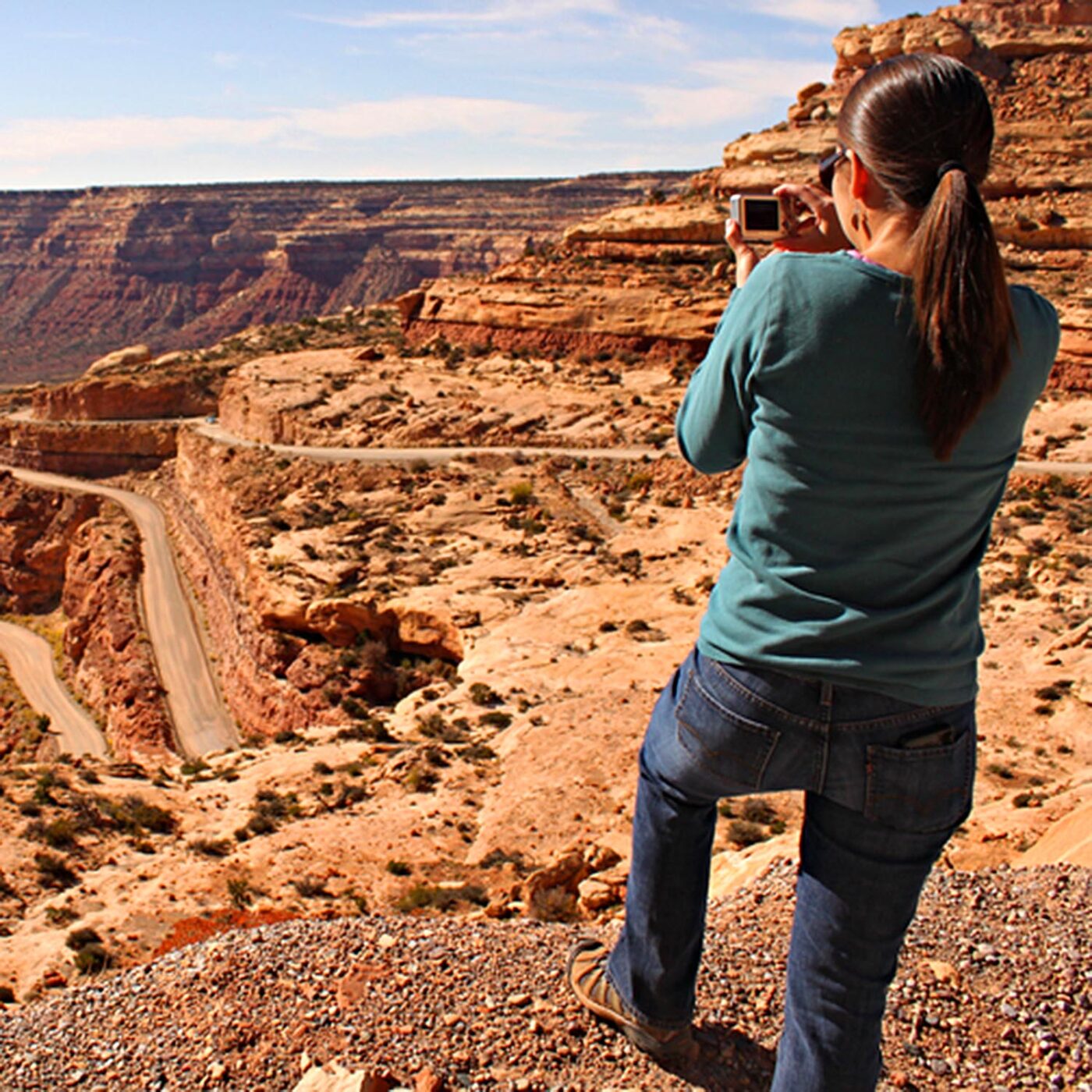 Traveller photographing the dramatic red rock scenery along Utah's Scenic Byway 12.