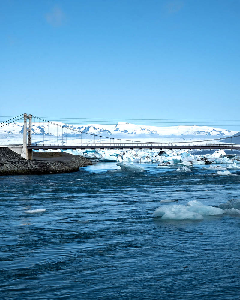 Icebergs being pulled under the bridge by the currents at Jökulsárlón Glacier Lagoon.