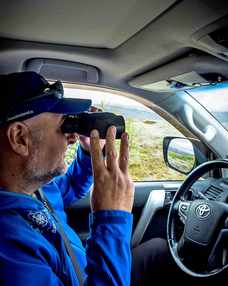 Scouting the glacial rivers ahead for safe passage across.