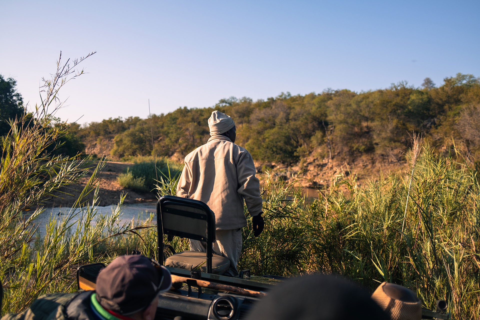 Off-roading by the river in search of lions.