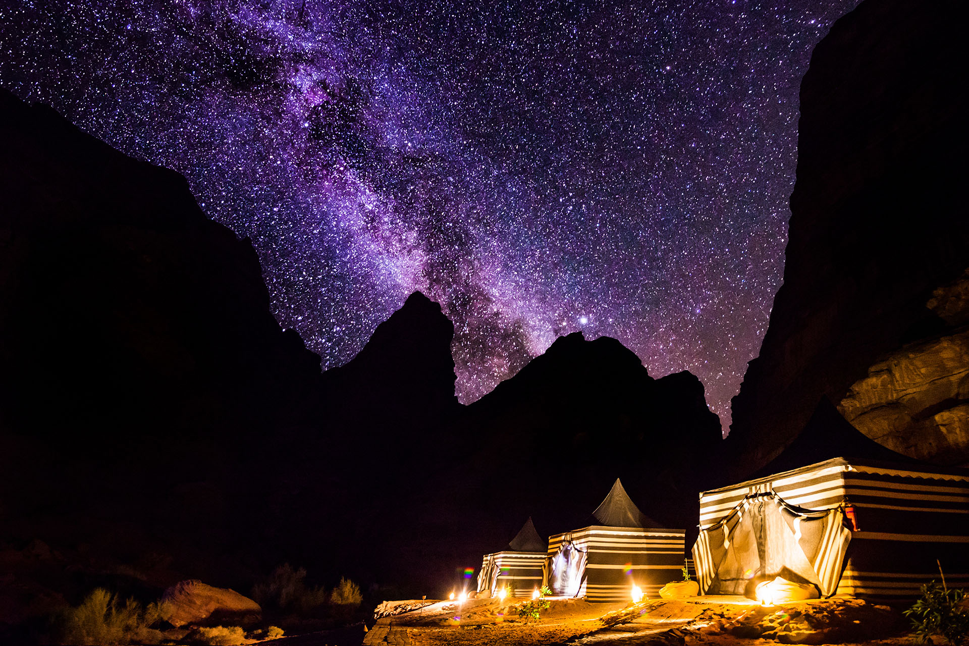A desert camp in Bedouin, Jordan underneath a sky full of stars.