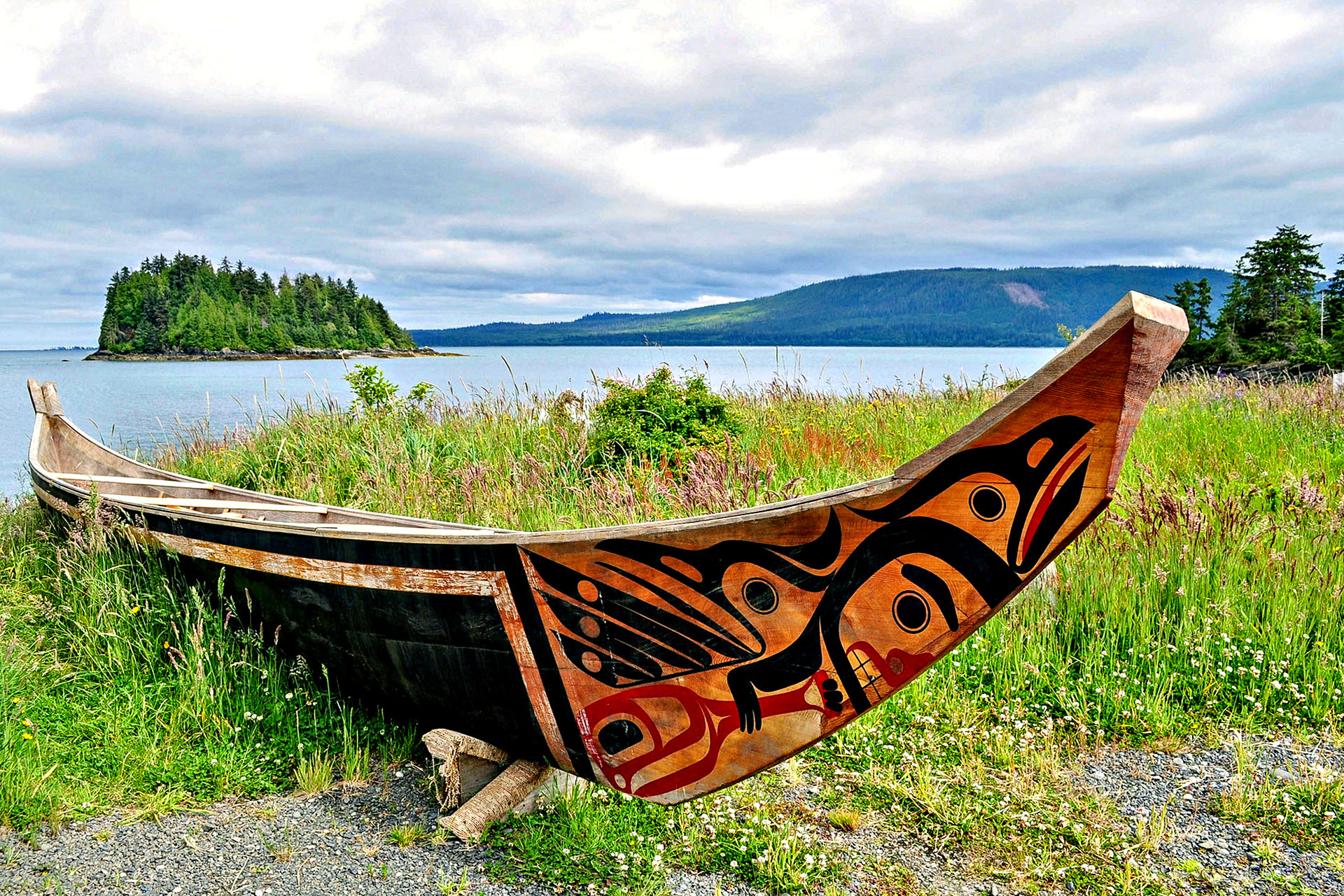 A traditional canoe on the banks of a river in Canada.