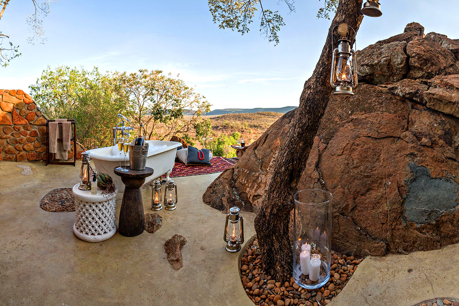 A bathtub sits at the edge of a precipe overlooking Madik We Game Reserve in South Africa.