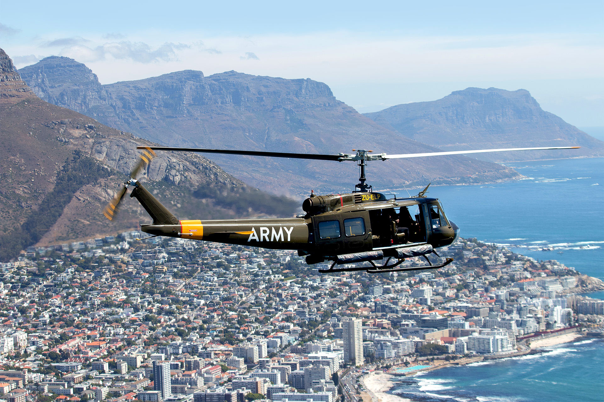 An army helicopter flies over the city of Cape Town in South Africa.
