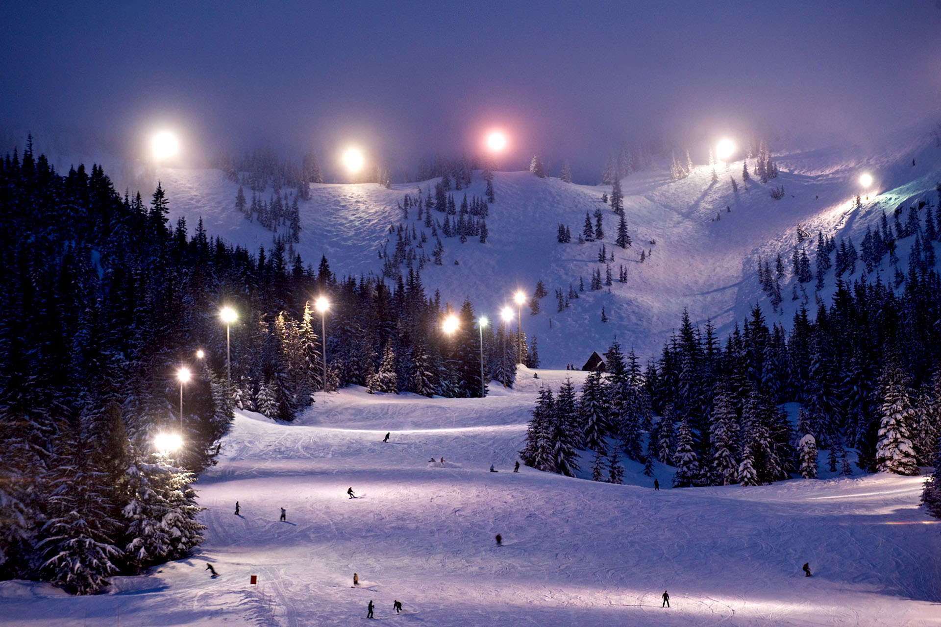 The skier-filled slopes at Mt Hood Skibowl at dusk.