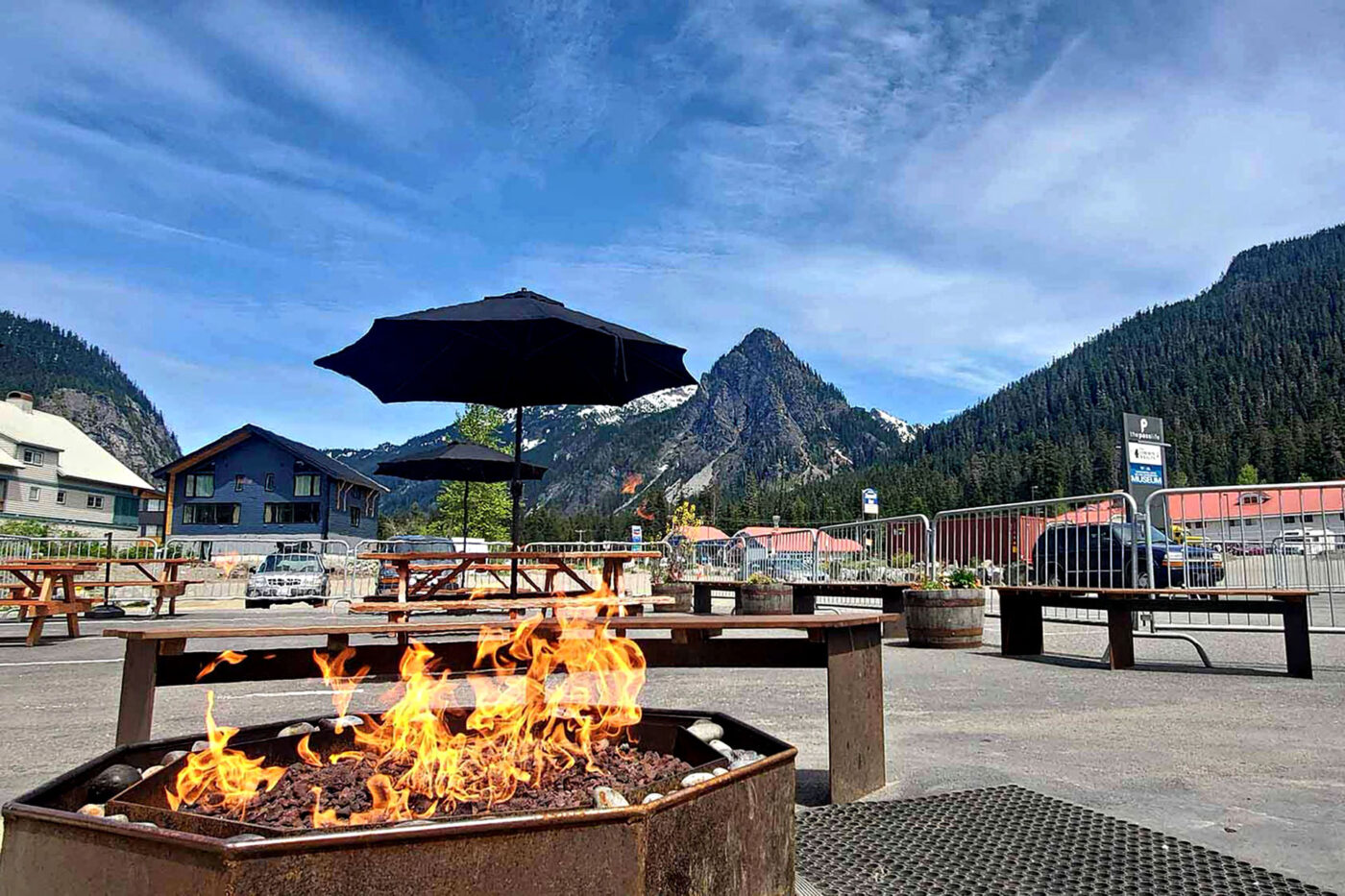A roaring fire pit in an outdoor seating area in Snoqualmie Pass, Washington.