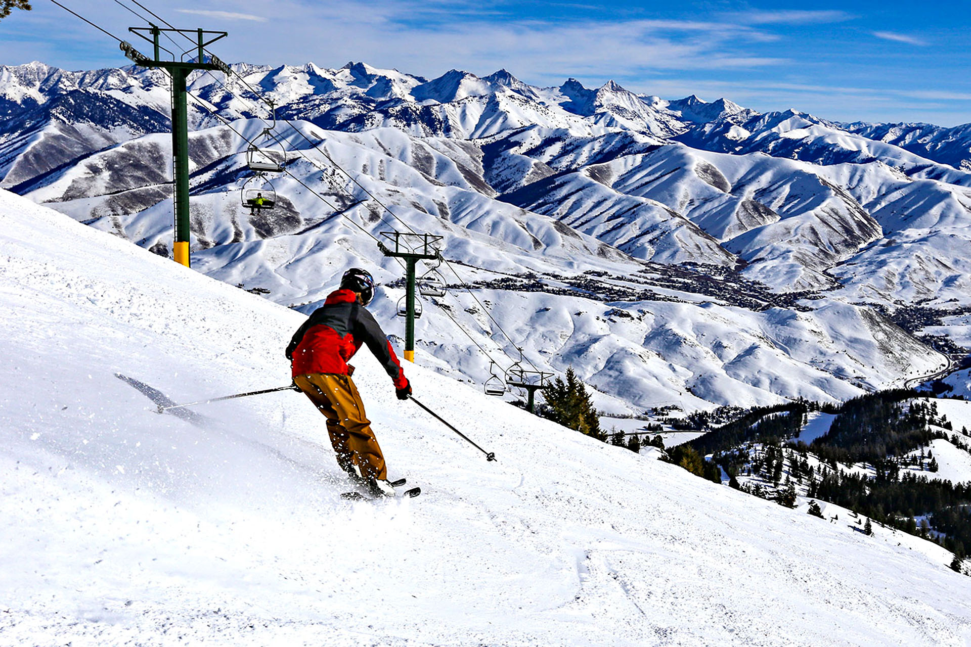 A lone skiier takes to the powdery white slopes.