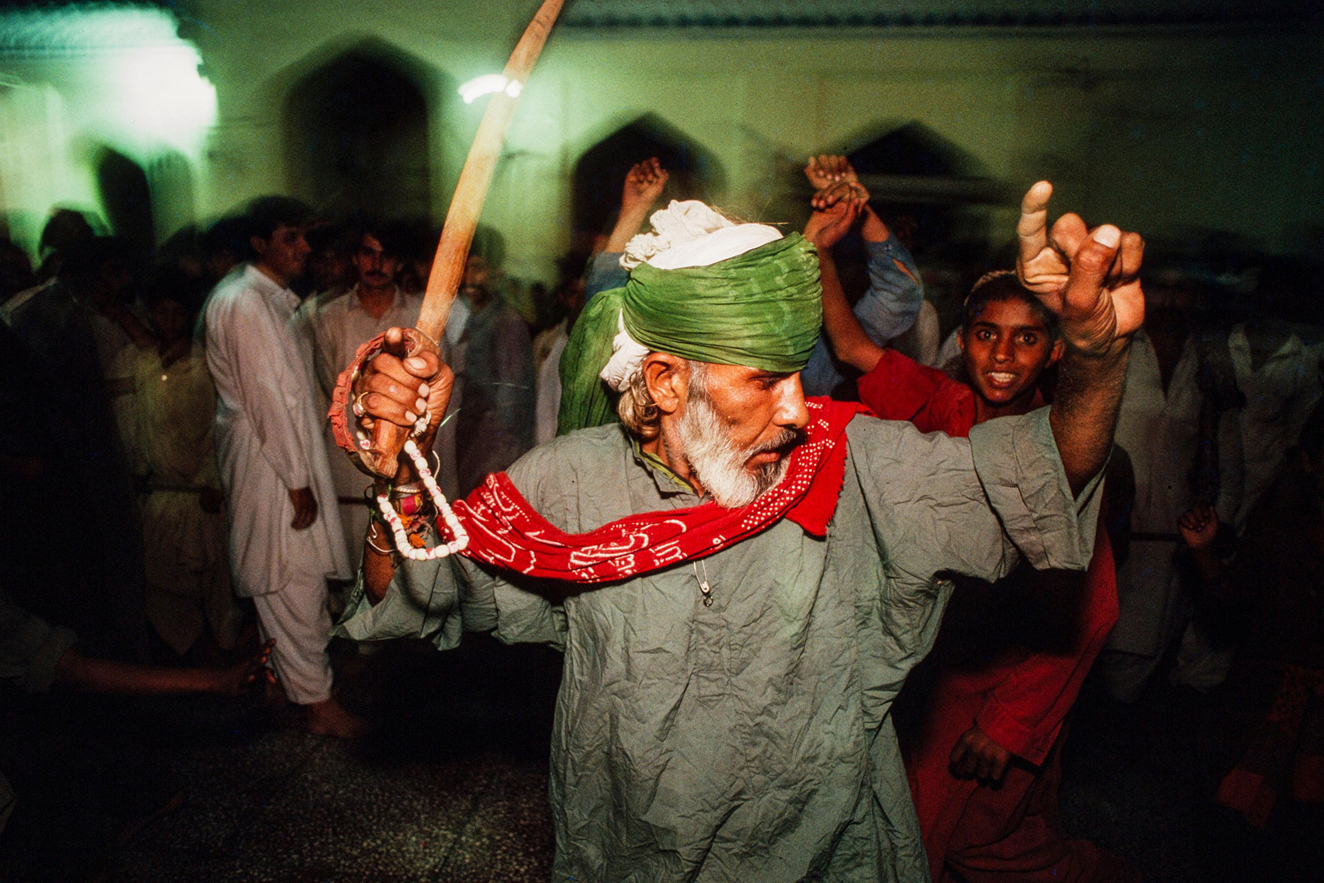 A man dancing during a cultural festival.