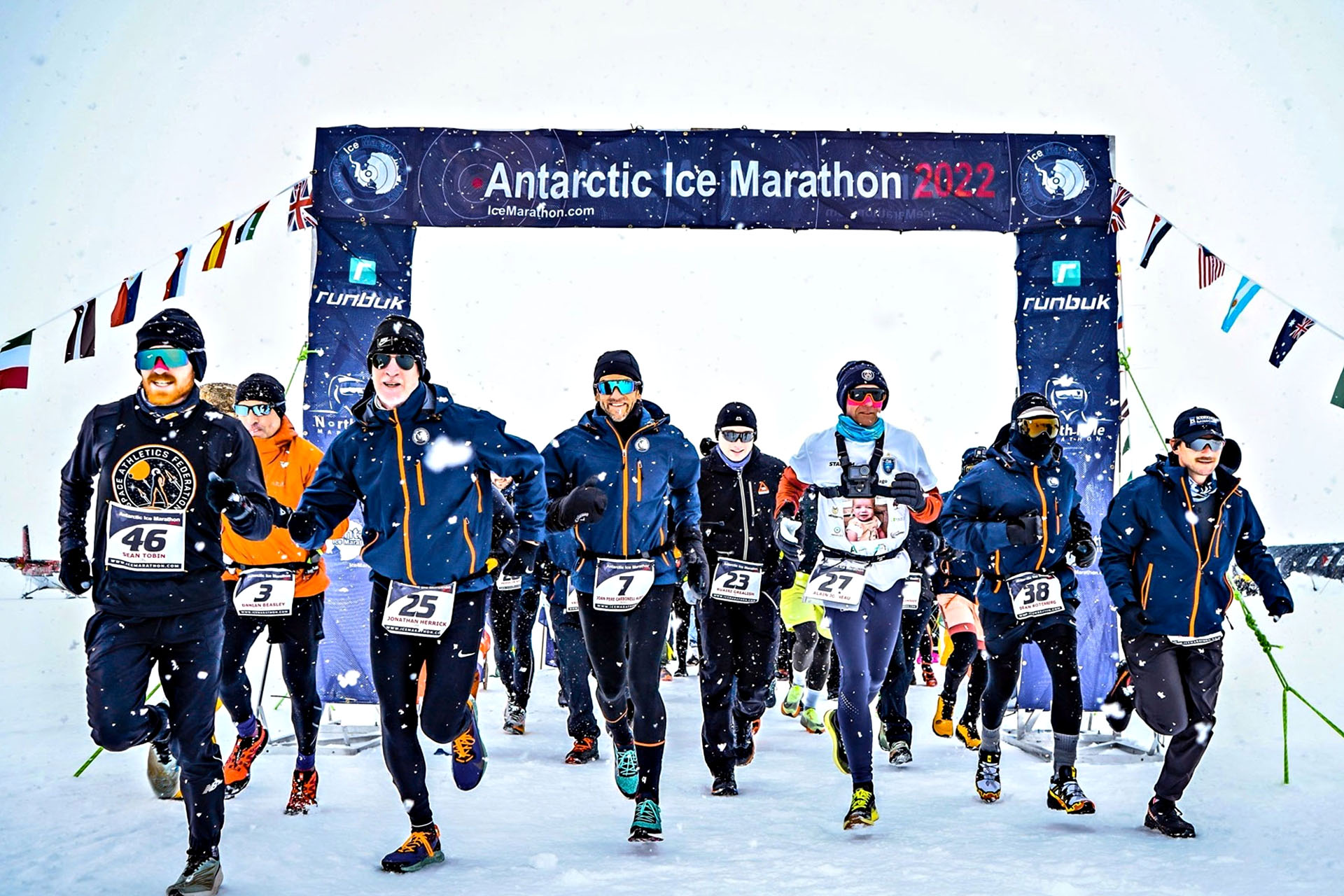 A group of runners at the starting line of marathon in Antarctica.