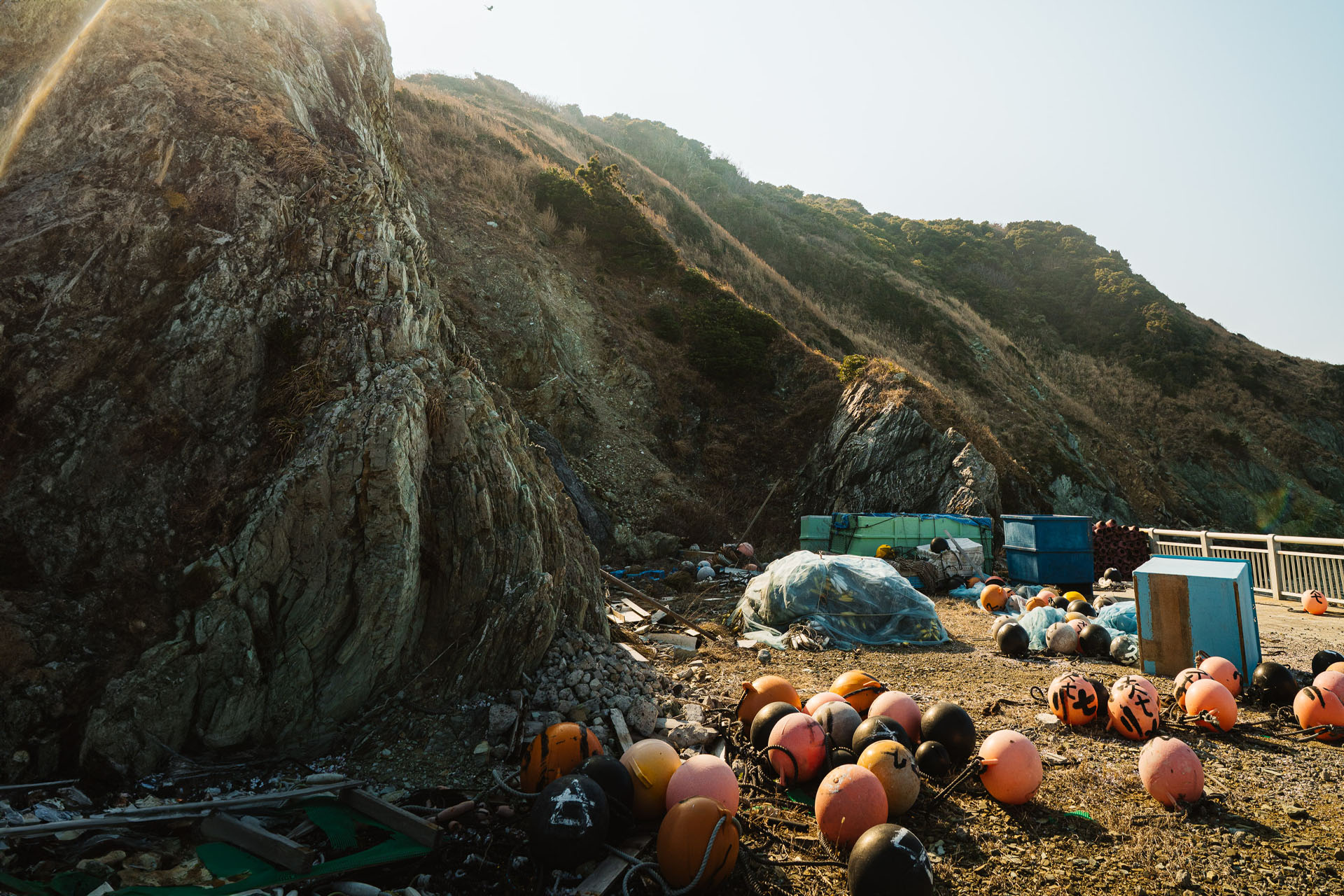 Sea-worn bouys drying (or forgetten?) in the late afternoon sun. 