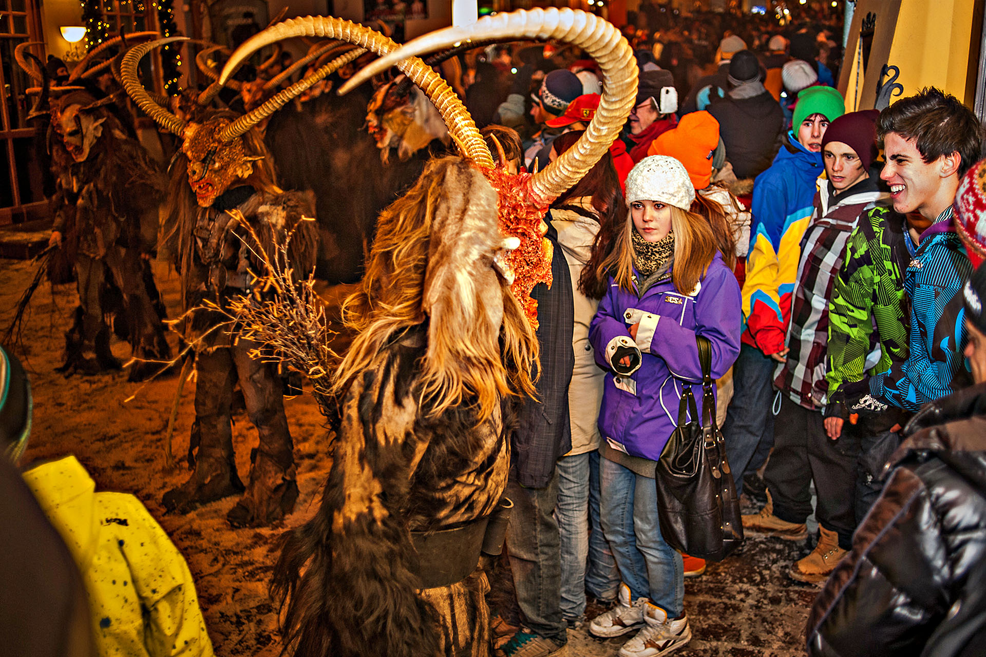 Fear appears on the faces of young locals as a demon approaches.