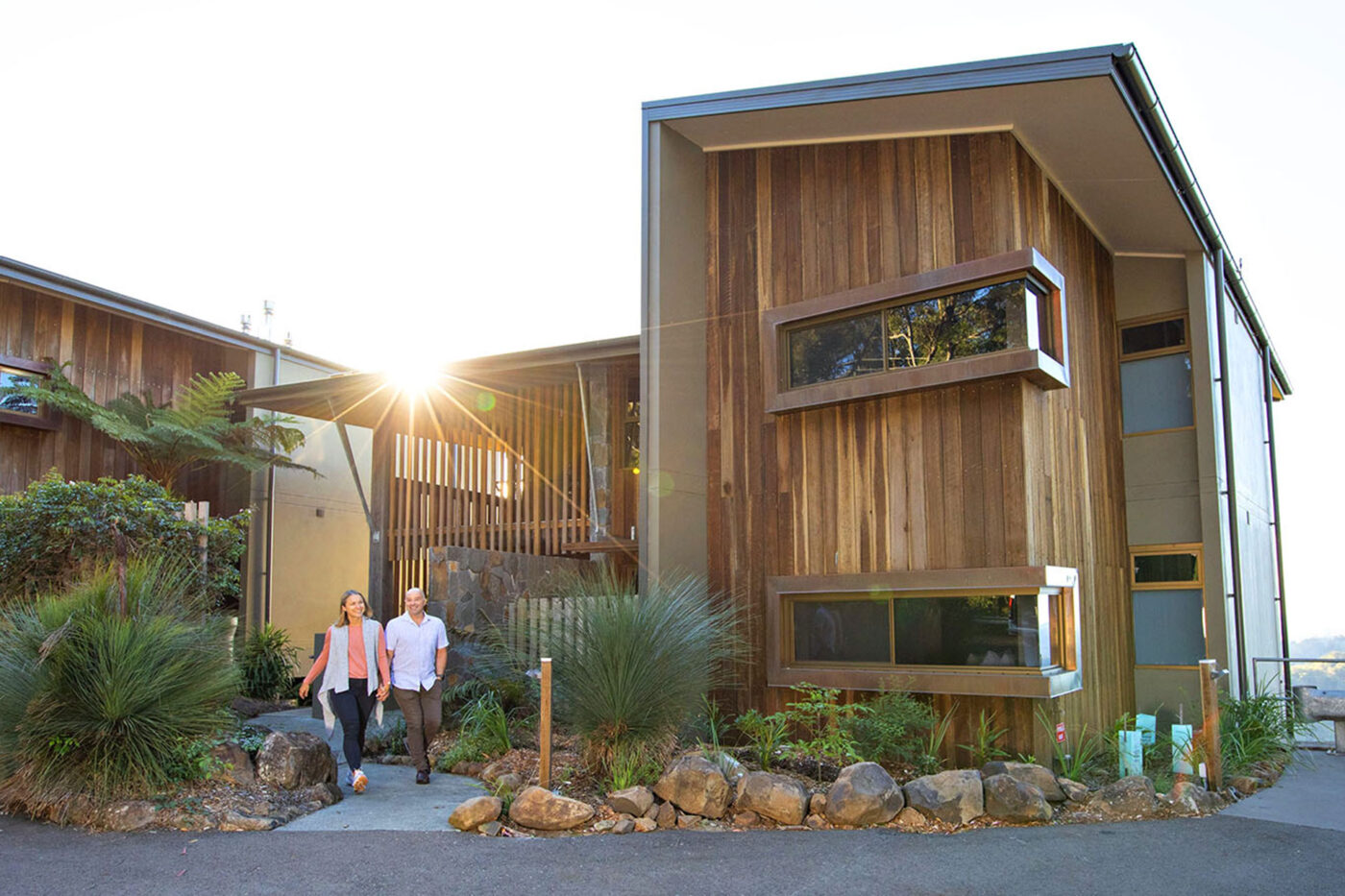 A couple walking out the Binna Burra lodges at Lamington National Park.