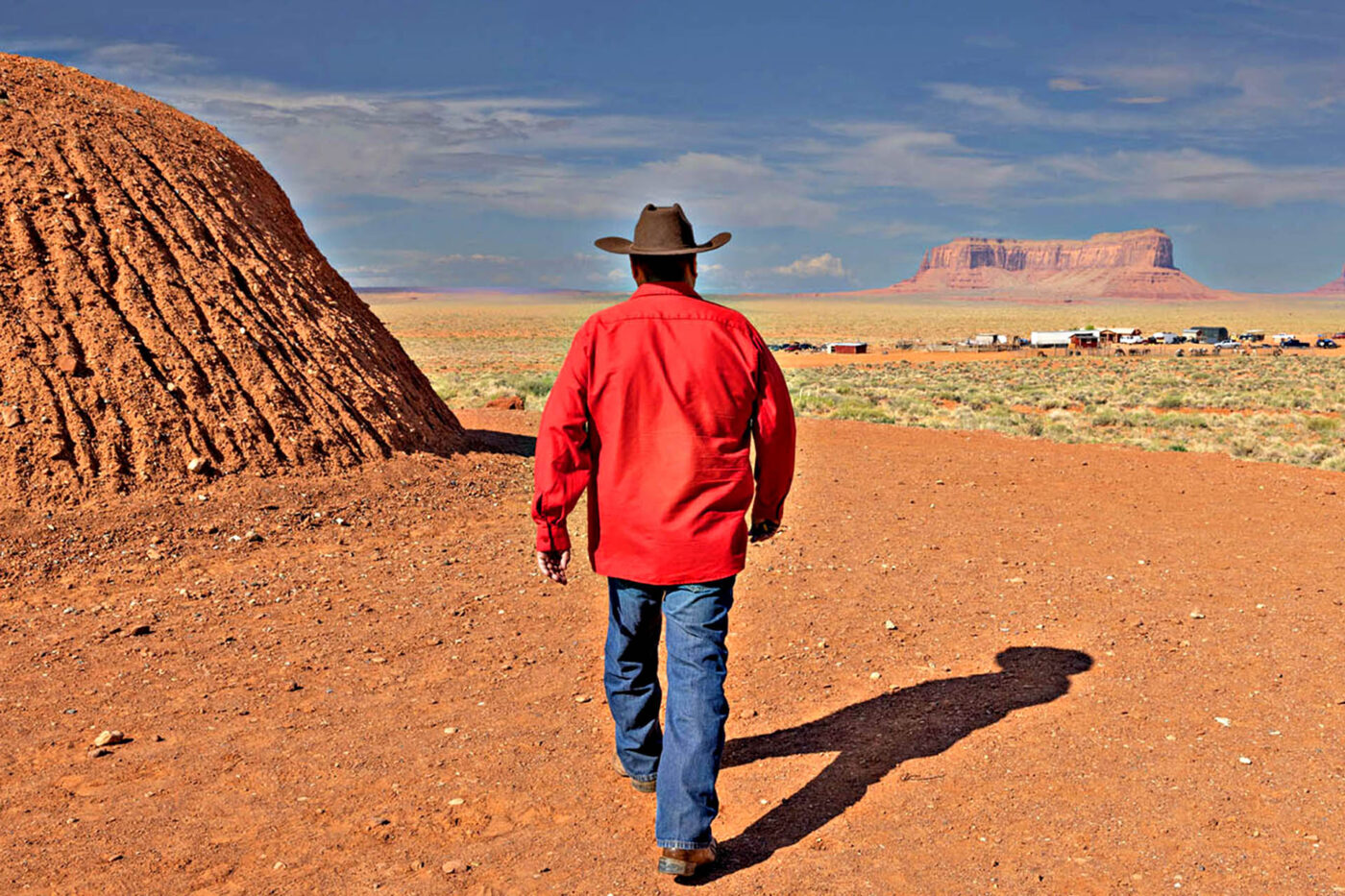 Cowboy walking off into the actual sunset.