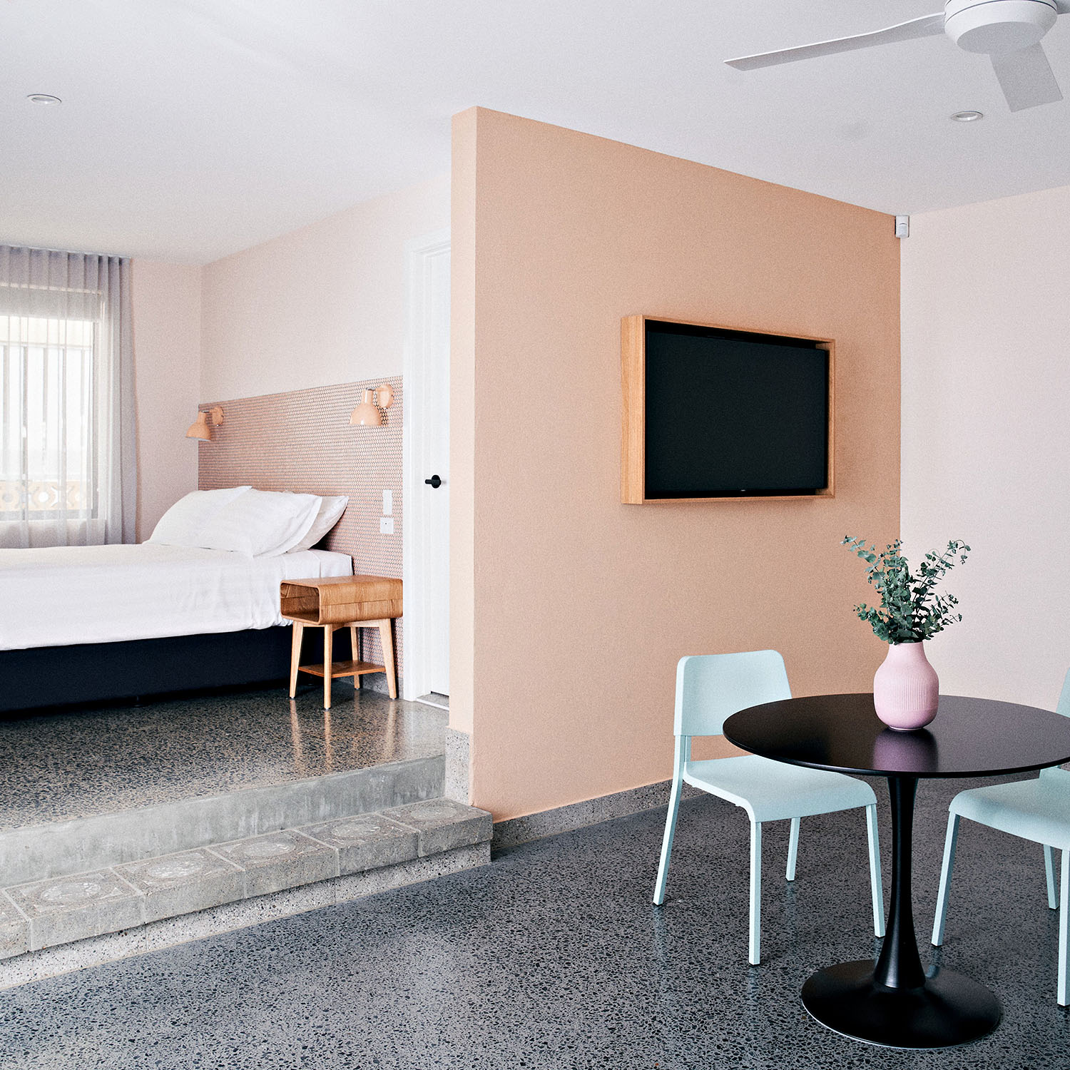 The interior at The Mysa Hotel is all polished concrete floors, pastel colours and minimalist design. 