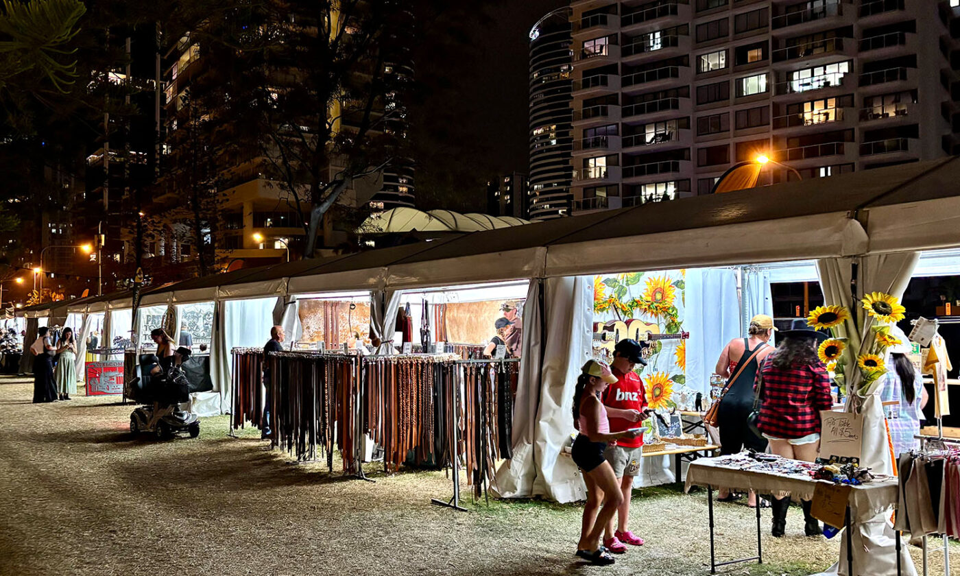 Market stalls lined up, ready to sell Country Music necessities such as belts and hats.