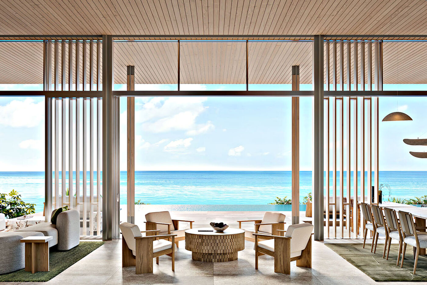 Modern villa interior at Amancaya featuring natural materials and open-plan island design.