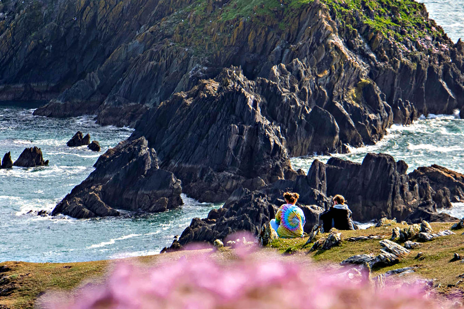 Two hikers take a break from trekking.