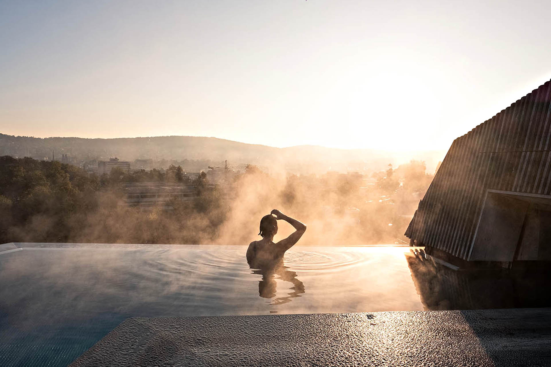 Thermal rooftop pool overlooking Zurich.