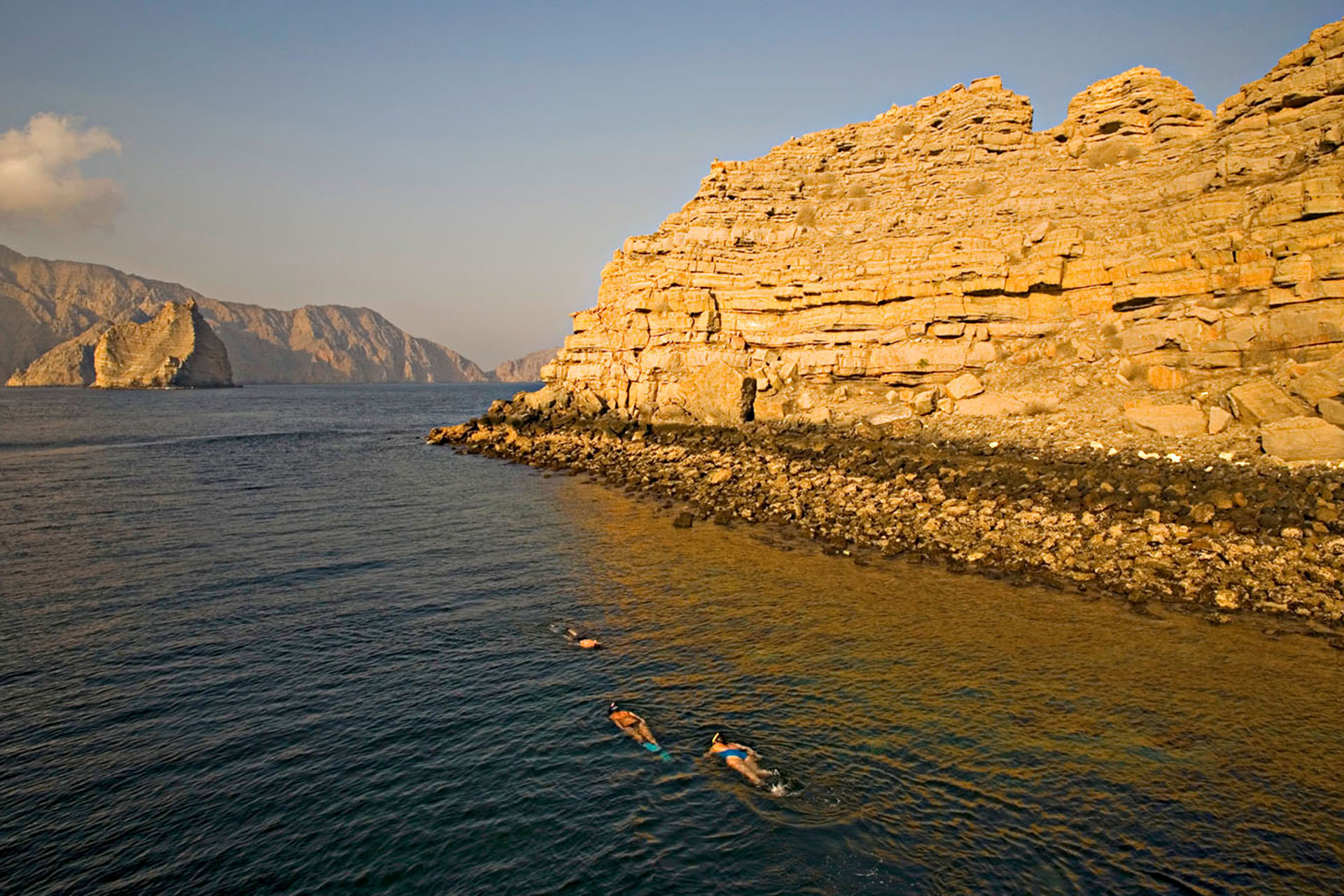 Passengers snorkel in the Sheesa Bay waters off Red Island.