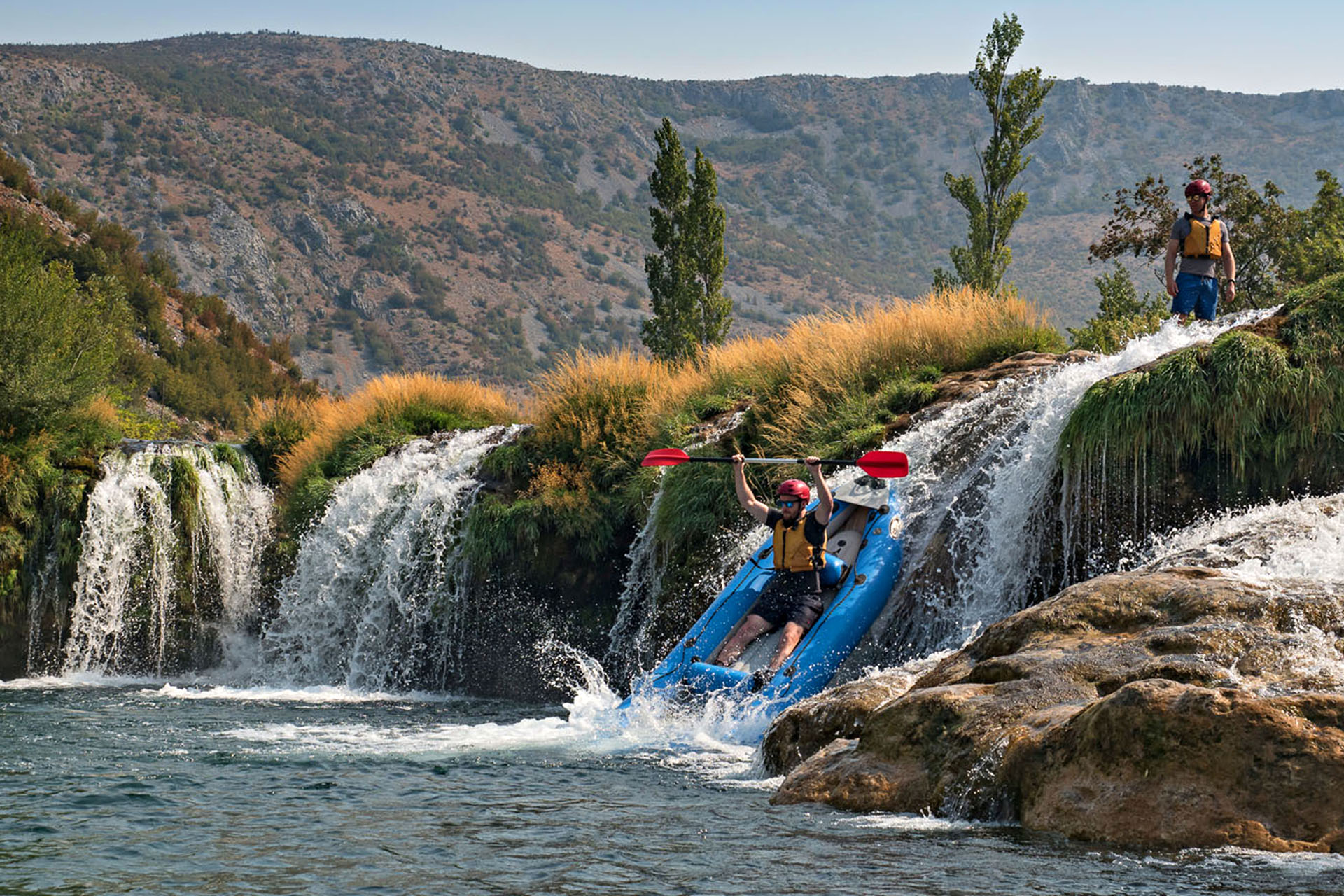 A kayaker launches off the 3.5-metre tall Ogar waterfall.