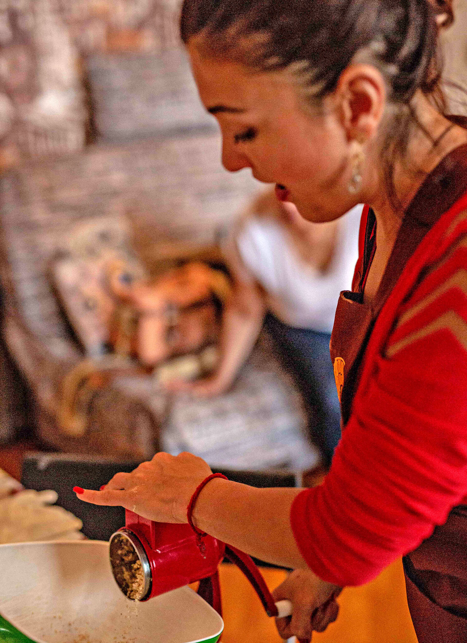 Baker Elmira grinding walnuts.
