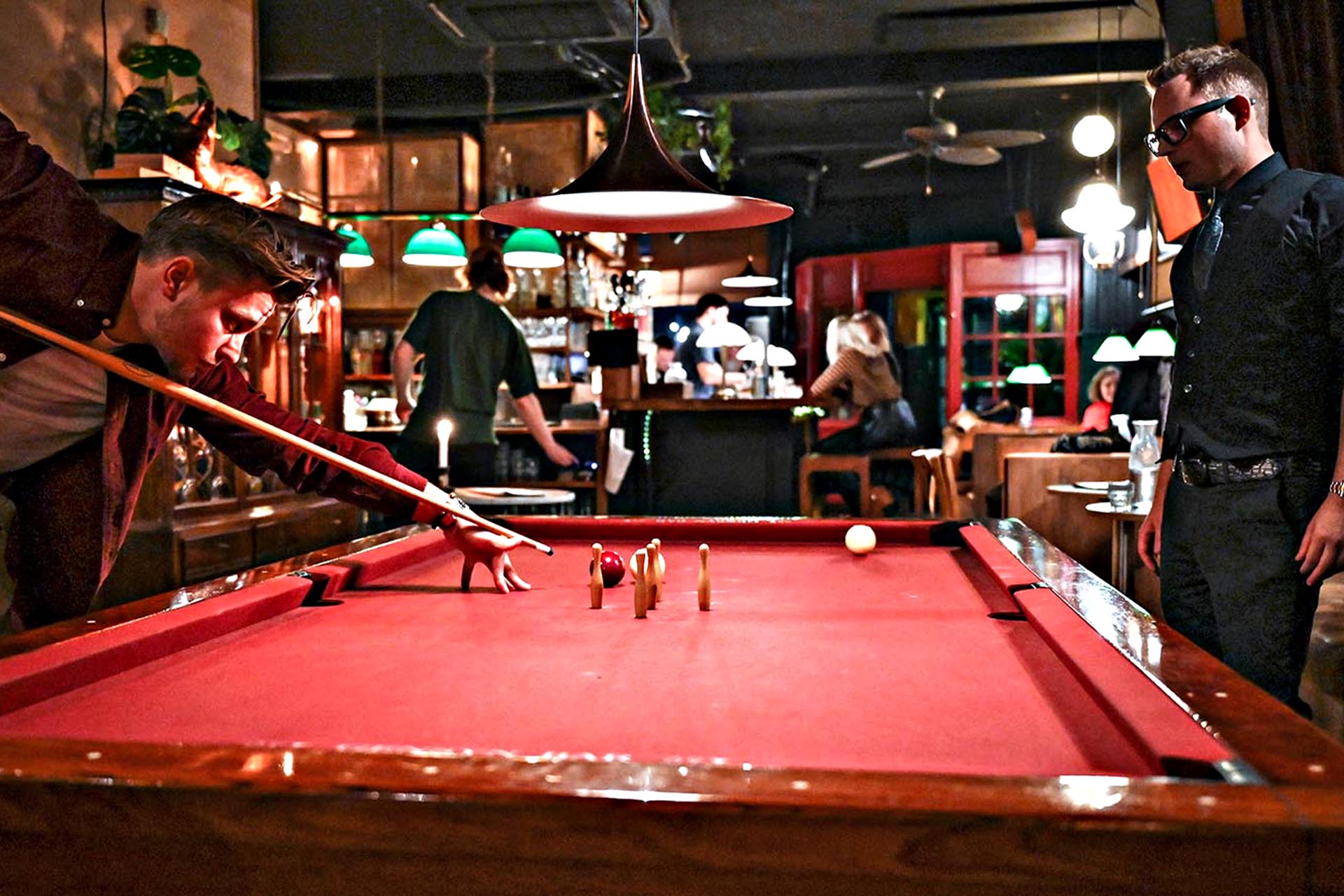 Playing Danish five-pin billiards at Gensyn Bar.