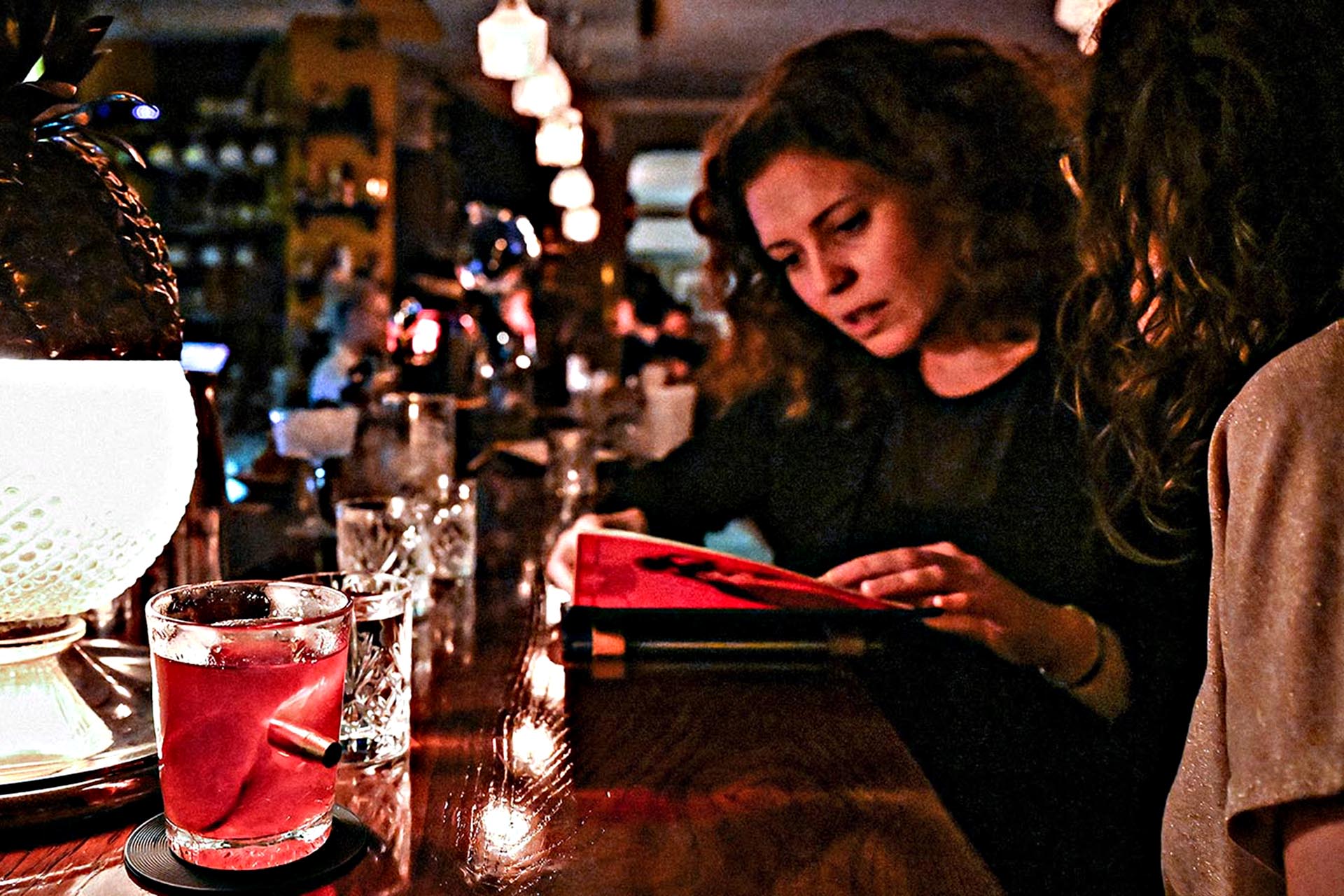Perusing the cocktail list at Curfew.
