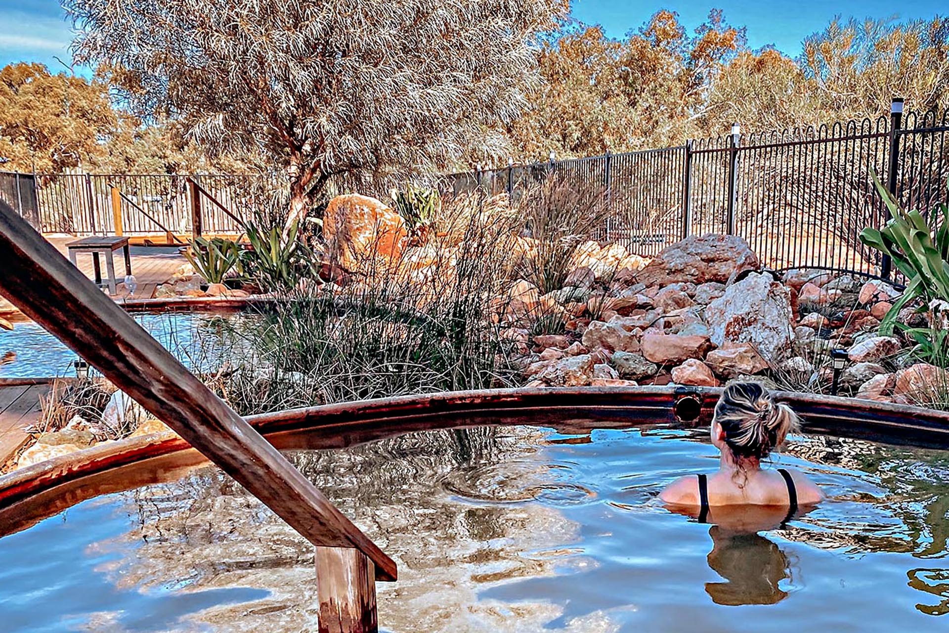 Travellers relaxing in hot springs at Wooramel River Retreat.