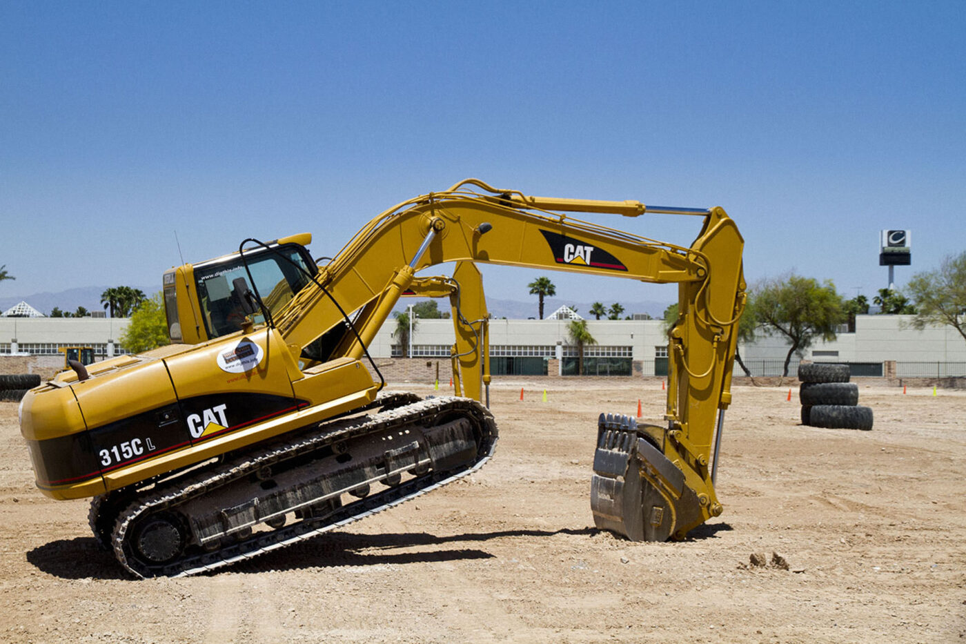 Popping a wheely in your excavator at Dig It Up.