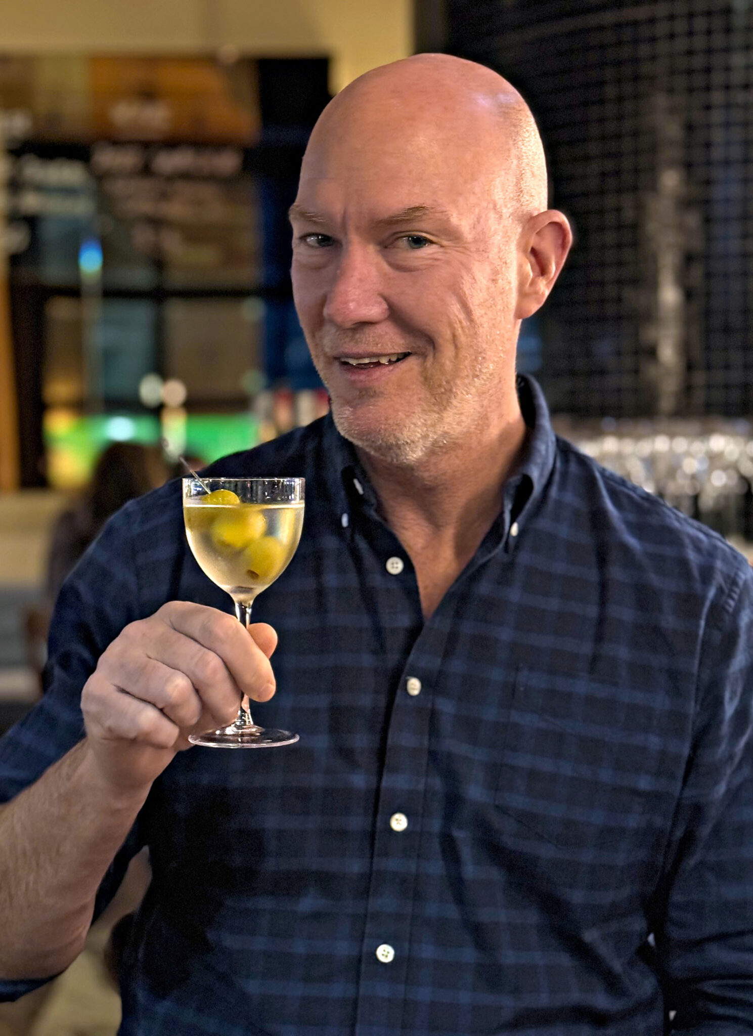 Guest enjoying a signature martini at Coupette Corner Bistro & Bar inside Hannah St Hotel, Melbourne.