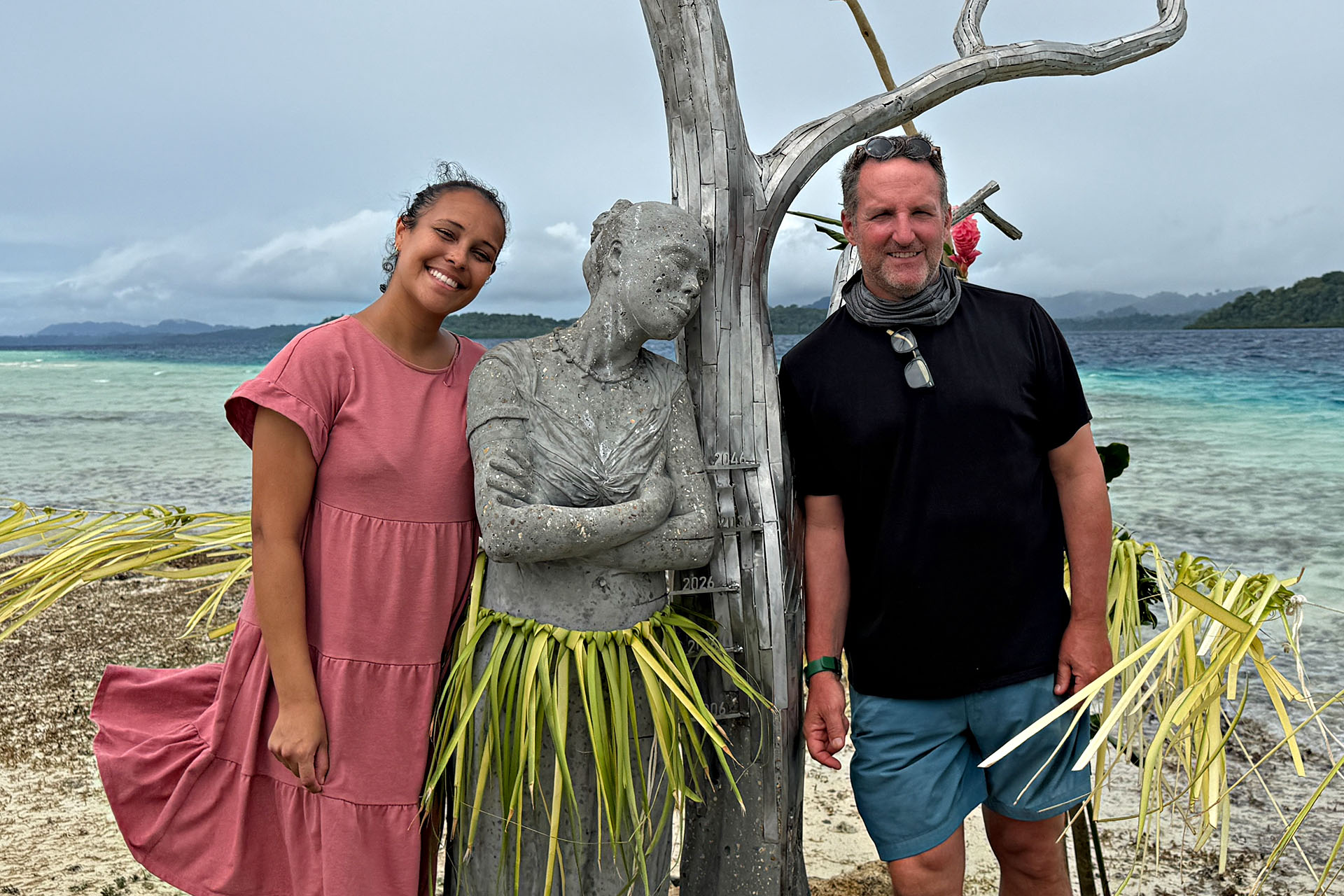 Artist Jason deCaires Taylor and Gladys Habu Bartlett beside the Solomon Siren sculpture in the Solomon Islands.