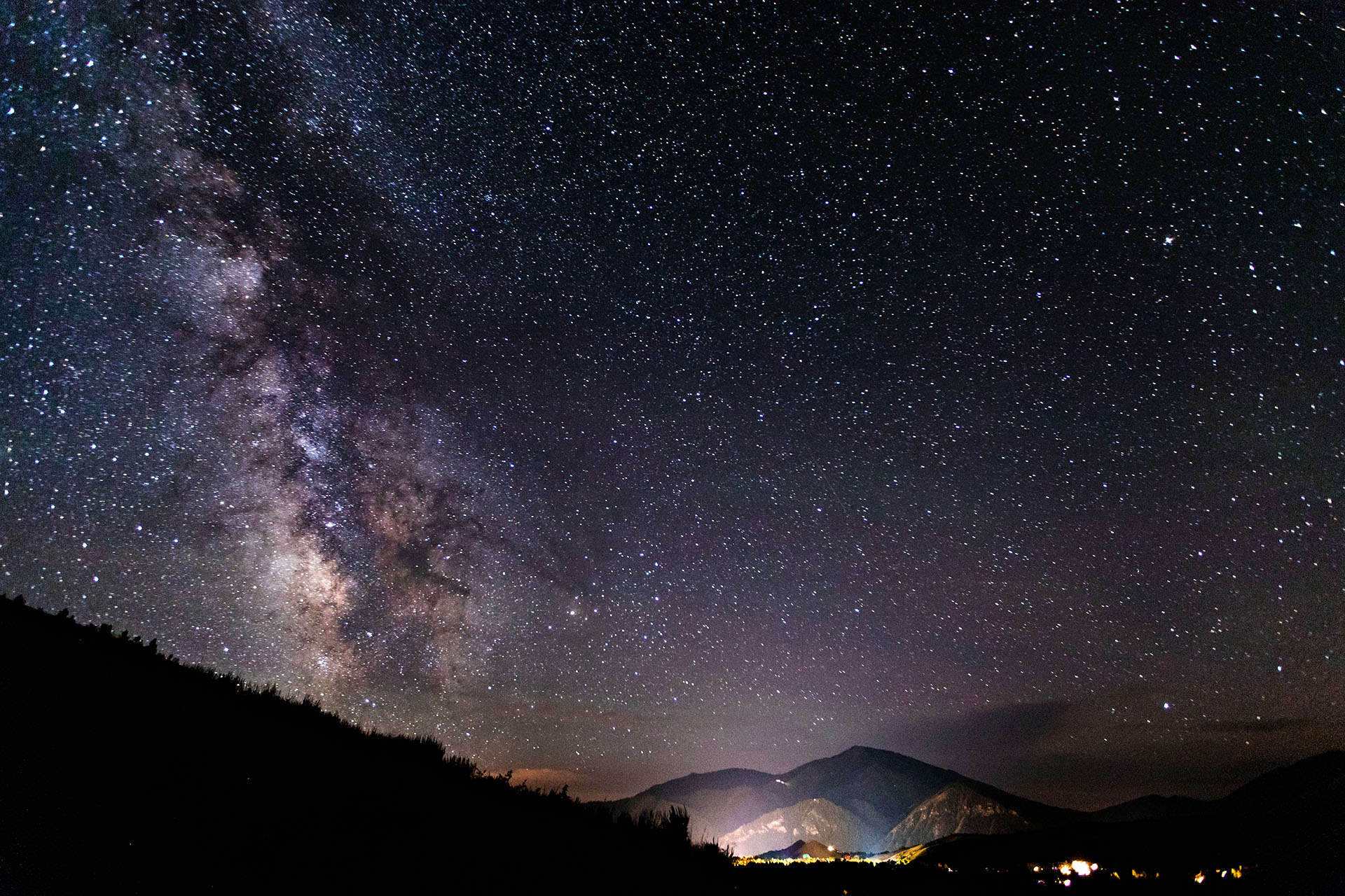 The Milky Way stretches across the night sky above the mountains surrounding Sun Valley, Idaho.