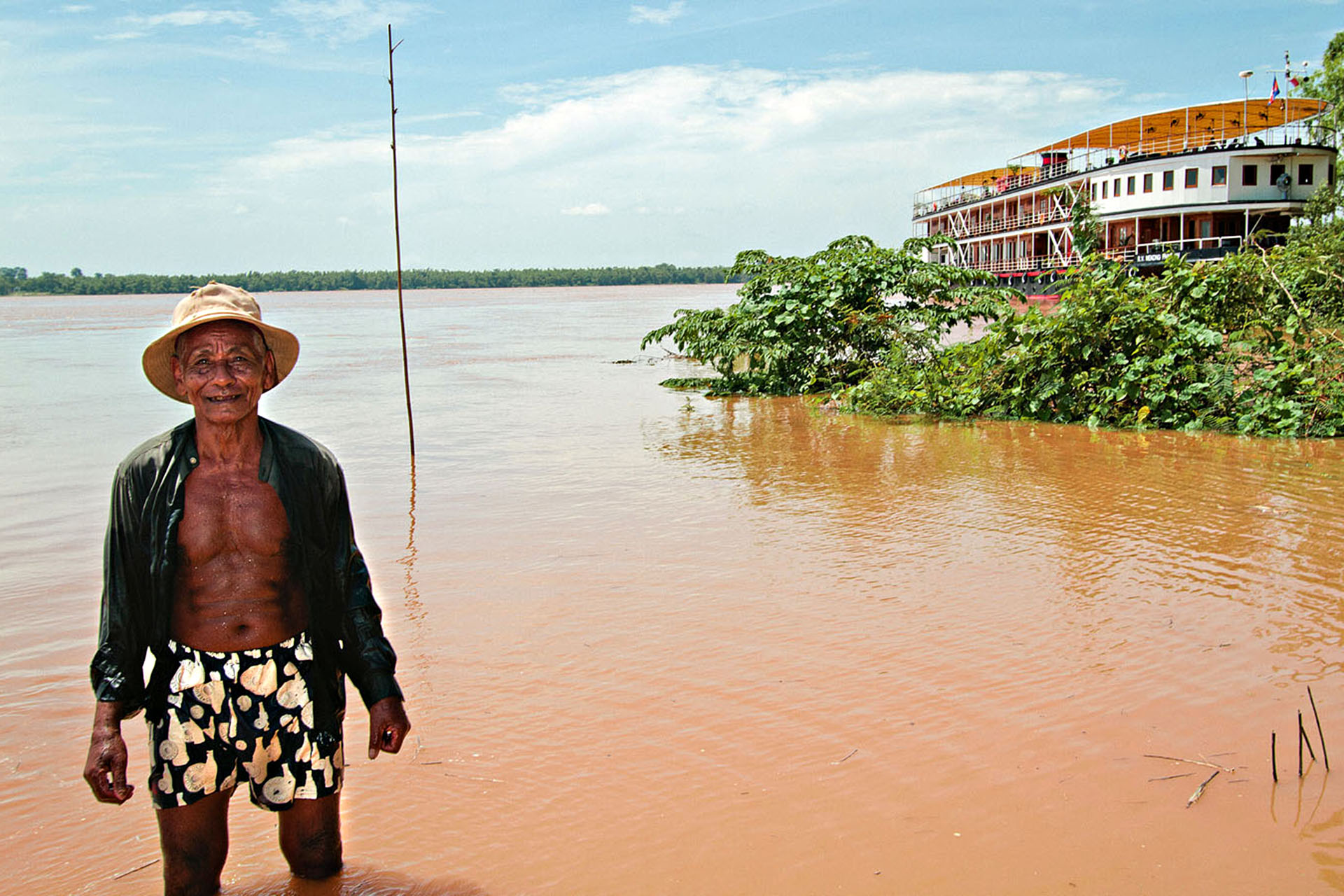 One of the many thousands of fishermen who ply the Mekong waterways.