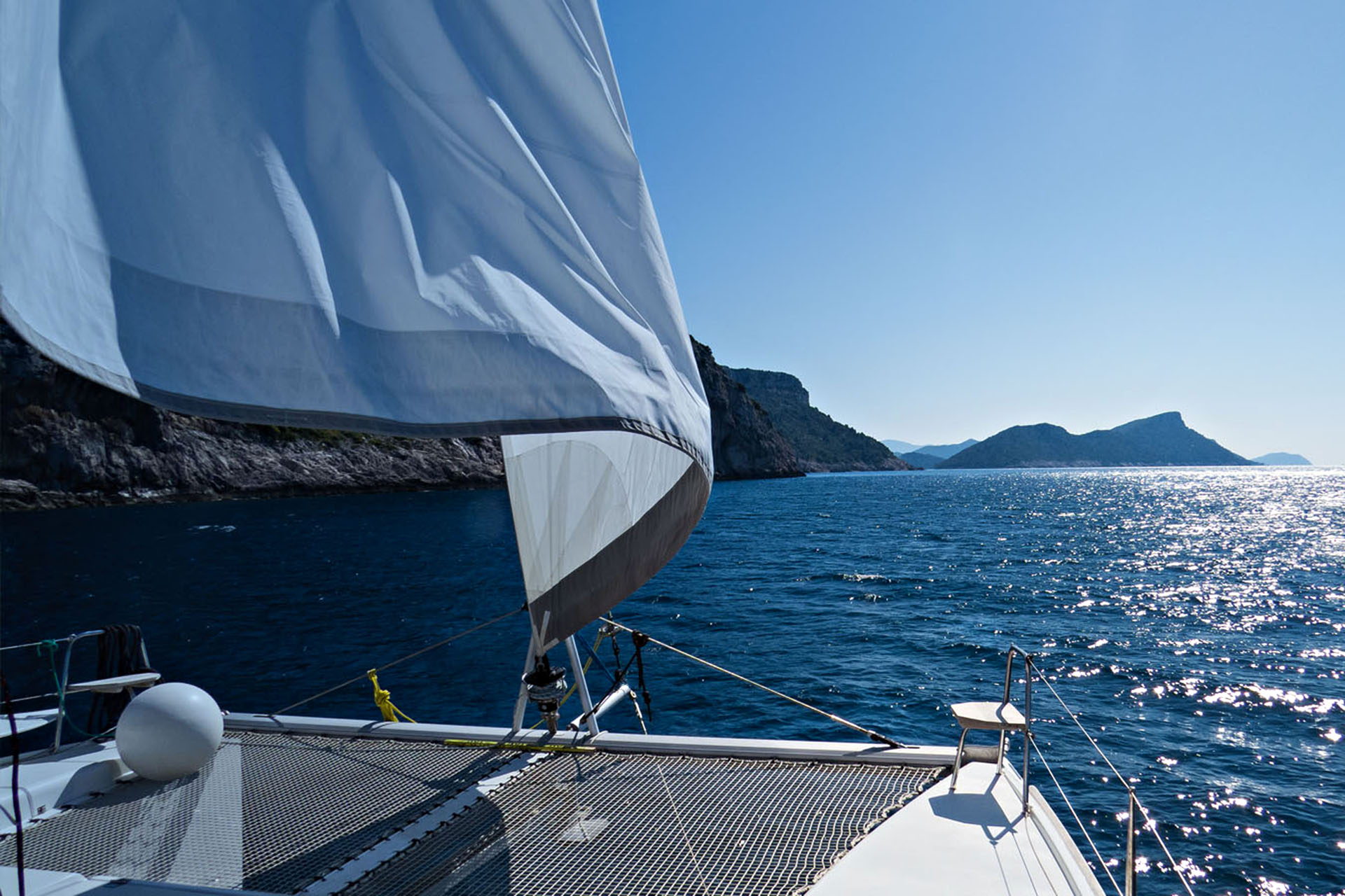 Skirting around islands aboard the catamaran Tom Sawyer.