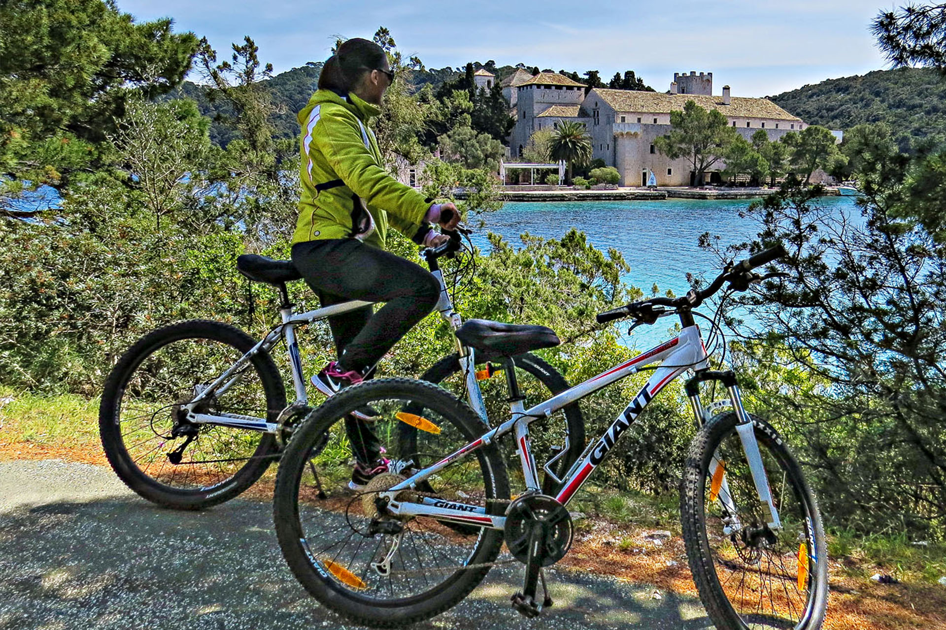 Cycling past a Benedictine monastery in Mljet National Park.