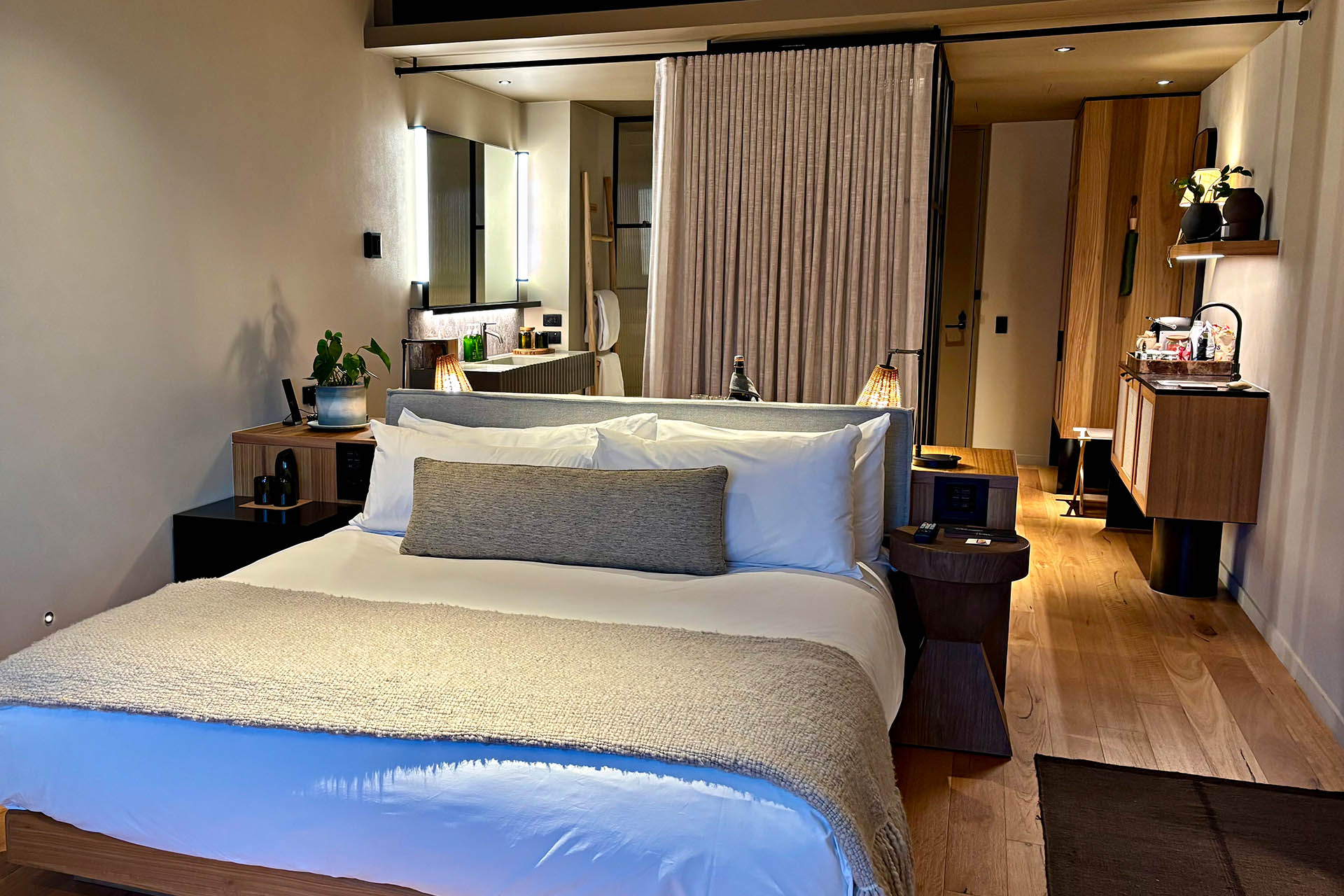 King room at 1 Hotel Melbourne featuring reclaimed timber furniture, organic materials and contemporary interiors.