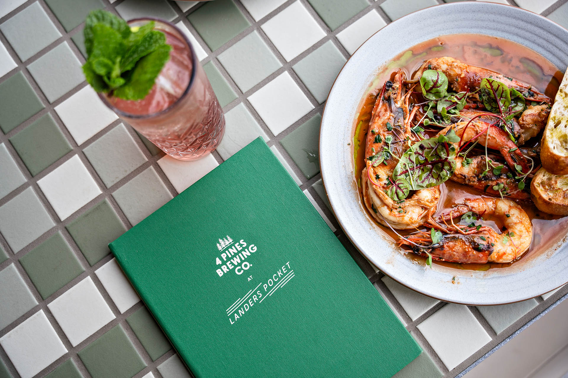 Prawn dish and cocktail served at Landers Pocket, Never Never Distilling Co.’s new Brisbane distillery venue.