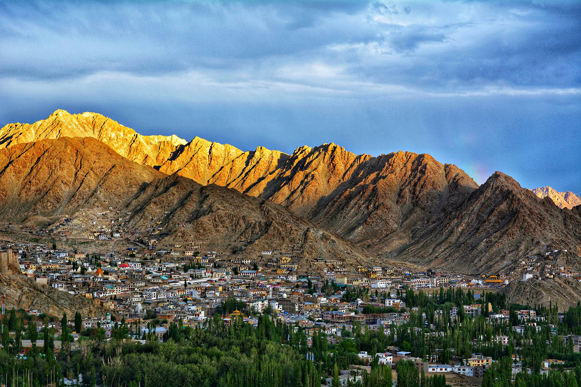 Leh city beneath the rugged Himalayan mountains in Ladakh, India.