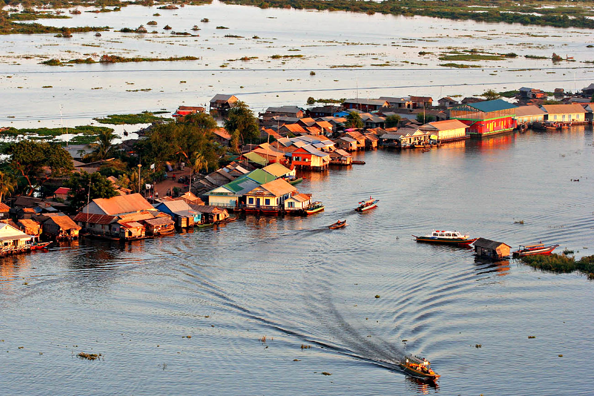 Floating village and boats on Tonle Sap Lake near Prek Toal, Cambodia.
