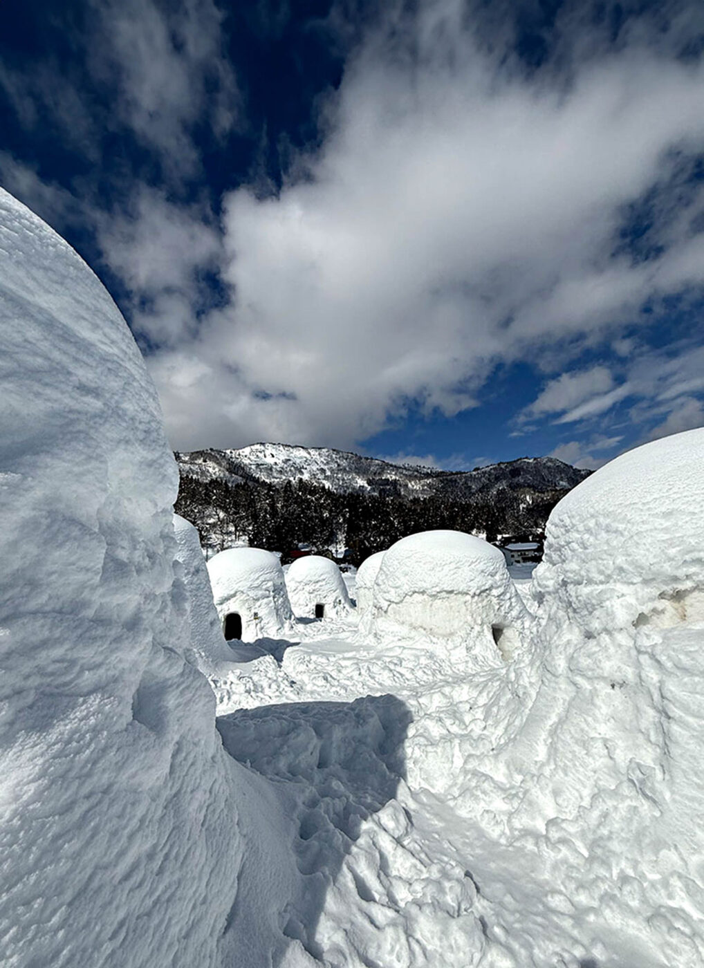Snow-covered kamakura igloos at Kamakura Village in Iiyama, Nagano, Japan.
