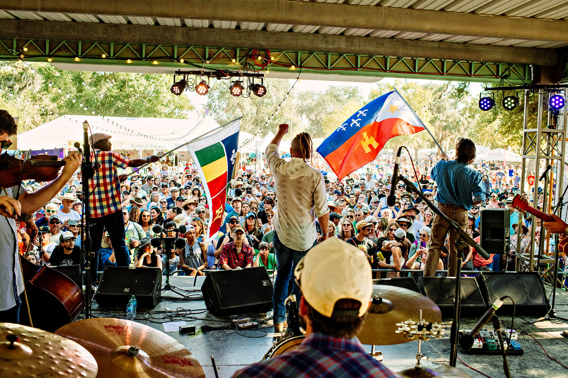 Cajun band performing to a packed crowd at Festivals Acadiens et Créoles in Louisiana.